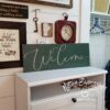 Welcome_-_Cathedral_Green_8x22_805c683d-a6a1-4556-ac26-a20af9f3f01e Welcome - Rustic Wood Sign - Netties Expressions